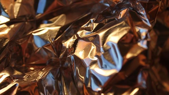 Gold prices holding support but look vulnerable as U.S. weekly jobless claims drop by 16k