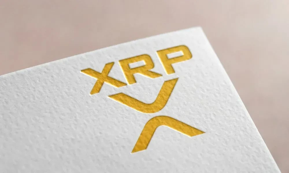 XRP at a critical juncture as bearish pennant forms and $1 support level comes into focus
